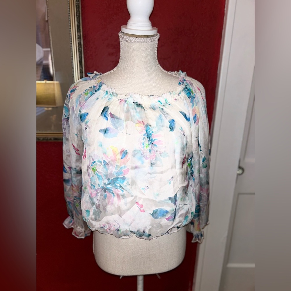 Womens multi colored blouse size medium worn once can be worn on/off shoulders